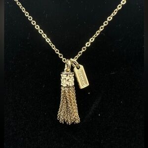 Coach Gold Tone Enamel Logo Tassel Fringe Pendant Necklace